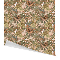 Hellebore Rose gift wrap featuring a dense floral pattern with brown flowers, white blossoms, and green leaves on a pink background. Illustrated by Lisel Ashlock.