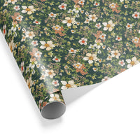 Rolled floral gift wrap with white daisies and coral flowers on dark green background, illustrated by Lisel Ashlock.