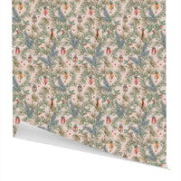 Deck the Halls gift wrap featuring botanical holiday florals in green, red, and gold on cream background. Illustrated by Lisel Ashlock.