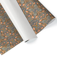 Rolls of apricot-colored decorative gift wrap with ornate floral and fan patterns in orange and gold. Illustrated by Lisel Ashlock.