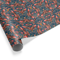 Rolled decorative gift wrap featuring coral and navy floral botanical pattern illustrated by Lisel Ashlock.