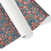 Rolls of blue rose patterned gift wrap with ornate floral design in coral and gold. Illustrated by Lisel Ashlock.