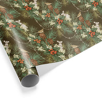Rolled gift wrap with woodland pattern featuring holly berries, pine cones, small animals and evergreen branches on moss background Illustrated by Lisel Ashlock