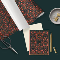 Flat lay of red and gold floral patterned gift wrap with coordinating thank you card, white ribbon, scissors, and gold pen on green background. Illustrated by Lisel Ashlock.