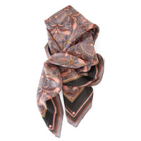 Silk cotton scarf in dusted lavender with copper filigree pattern, draped elegantly against white background. Illustrated by Lisel Ashlock.