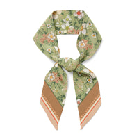 Green silk twill scarf with white daisies, coral flowers, and tan border with coral stripe. Illustrated by Lisel Ashlock.