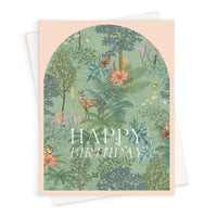 A greeting card with woodland meadow illustration featuring a deer, butterfly, and flowers with "Happy Birthday" text. Illustrated by Lisel Ashlock.