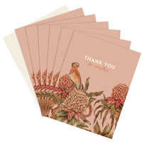 A fanned stack of peachy-pink "Thank You for everything" greeting cards illustrated with a kestrel bird and protea flowers. Illustrated by Lisel Ashlock.