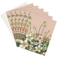 A fan of pink greeting cards with white anemone flowers and "Love you" text. Illustrated by Lisel Ashlock.