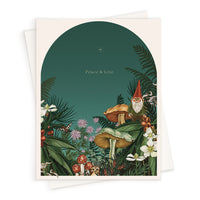 Whimsical holiday greeting card featuring a gnome in a mushroom forest with "Peace & Love" text. Illustrated by Lisel Ashlock.