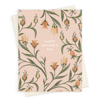 Mother's Day greeting card with delicate illustrated flowers in orange and green on a soft pink background. Illustrated by Lisel Ashlock.