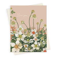 A "Love You" greeting card featuring white anemones and green buds on a pink background. Illustrated by Lisel Ashlock.