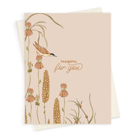 Greeting card with "Thankful for you" text and illustration of a bird among wildflowers and grasses. Illustrated by Lisel Ashlock.