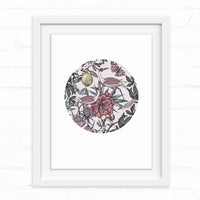Circular botanical illustration featuring exotic birds, flowers, and fruit in muted tones framed in white. Illustrated by Lisel Ashlock.