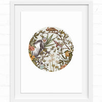 A circular illustration of a colobus monkey surrounded by botanical elements including flowers, leaves, and a chameleon. Illustrated by Lisel Ashlock.