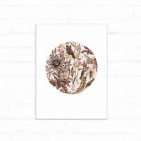 Circular botanical illustration featuring owls and birds among flowers and foliage in sepia tones on white paper. Illustrated by Lisel Ashlock.