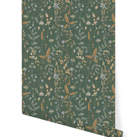 Rolled wallpaper with botanical pattern in green, gold, and cream featuring various dried flowers and plants. Illustrated by Lisel Ashlock.