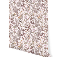 Rolled sample of Secret Garden Wallpaper in blush tones featuring botanical illustrations by Lisel Ashlock.