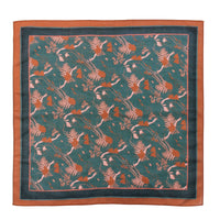 Silk cotton scarf with teal center featuring red and pink botanical pattern, bordered by orange and dark blue edges. Illustrated by Lisel Ashlock.