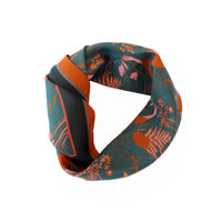 Viridian silk cotton scarf with orange botanical illustrations featuring ferns and foliage. Illustrated by Lisel Ashlock.