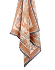 Sunstone silk cotton scarf with botanical fern and floral design in terracotta and cream, illustrated by Lisel Ashlock.