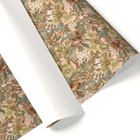 Rolled floral gift wrap with hellebore and rose pattern in rose, green, and brown tones. Illustrated by Lisel Ashlock.