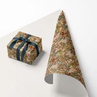 Hellebore Rose gift wrap displayed on a wrapped box and cone-shaped roll against white background. Illustrated by Lisel Ashlock.