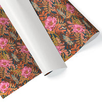 Rolled floral gift wrap featuring pink peonies and orange leaves on dark background. Illustrated by Lisel Ashlock.
