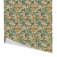 Repeating pattern of monkeys among tropical foliage in greens and golds on pink background gift wrap. Illustrated by Lisel Ashlock.