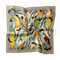 Silk cotton scarf featuring yellow banksias, teal foliage, butterflies, and birds in botanical illustration style. Illustrated by Lisel Ashlock.