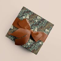 Boughs & Berries in Cedar gift wrap with copper ribbon bow on beige background. Illustrated by Lisel Ashlock.