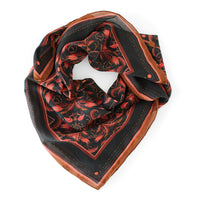 Bright Mahogany Filigree silk cotton scarf with red floral patterns on black and rust border. Illustrated by Lisel Ashlock.