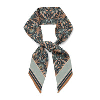 Moonstone Monkey silk twill twilly scarf with botanical and celestial motifs in charcoal, copper, and sage. Illustrated by Lisel Ashlock.