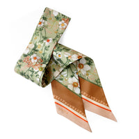 Silk twill twilly scarf with floral anemone print in cream, green, and coral tones. Illustrated by Lisel Ashlock.