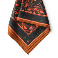 Silk twill scarf with bright mahogany filigree floral pattern and gold border, illustrated by Lisel Ashlock.
