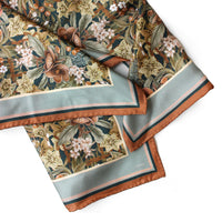 Midnight Hellebore silk twill scarf with botanical florals, bordered in sage and copper. Illustrated by Lisel Ashlock.