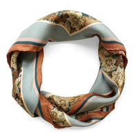 Silk twill scarf in sage green, rust, and cream with floral hellebore pattern and horizontal stripes. Illustrated by Lisel Ashlock.