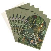 A set of six holiday greeting cards featuring woodland forest illustrations with plants, animals, and a gnome, illustrated by Lisel Ashlock.