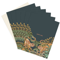 Fan arrangement of navy greeting cards with gold botanical and monkey illustrations and "Love You" text. Illustrated by Lisel Ashlock.