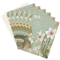 Stack of Mother's Day greeting cards featuring white daffodils and snowdrops on sage green background. Illustrated by Lisel Ashlock.