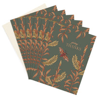 A stack of "Giving Thanks" greeting cards featuring botanical illustrations in rust and gold on a sage green background, illustrated by Lisel Ashlock.