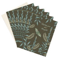 A set of sympathy greeting cards with olive background, botanical illustrations, and "keeping you in my thoughts" text. Illustrated by Lisel Ashlock.