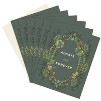 Stack of "Always and Forever" greeting cards with botanical illustrations on sage green covers. Illustrated by Lisel Ashlock.