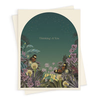 Greeting card with "Thinking of You" text in an arched night garden scene with butterflies and flowers. Illustrated by Lisel Ashlock.