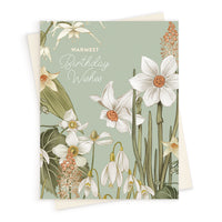 Birthday greeting card with sage green background and botanical illustrations of white daffodils and snowdrops. Illustrated by Lisel Ashlock.