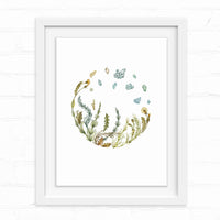 Watercolor illustration of wildflowers and herbs arranged in a circular wreath with floating leaves above, Illustrated by Lisel Ashlock.