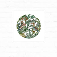 Circular botanical illustration featuring tropical flowers and foliage with a colorful hoopoe bird perched among blooms. Illustrated by Lisel Ashlock.