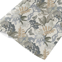 Rolled gift wrap featuring botanical illustrations with flowers, leaves, butterflies and dark foliage in muted tones. Illustrated by Lisel Ashlock.