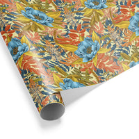 Rolled gift wrap featuring a vibrant floral pattern with blue peonies, coral flowers, and yellow leaves on cream background. Illustrated by Lisel Ashlock.