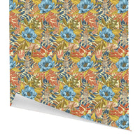 Colorful gift wrap with blue, yellow, and coral floral pattern, edge peeling back. Illustrated by Lisel Ashlock.